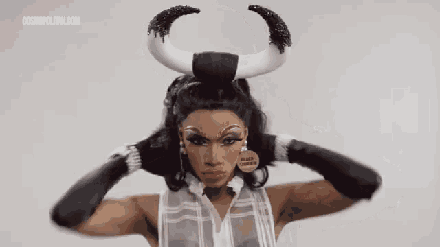 a woman is wearing a bull costume with horns