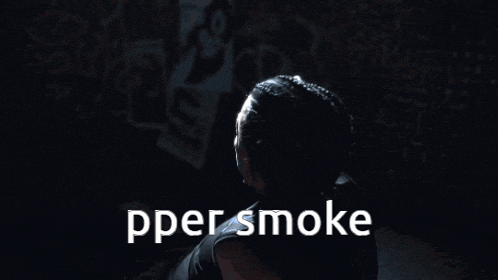 a person in a dark room with the words pper smoke written on the bottom