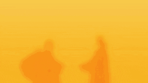 two men are shaking hands in the desert .
