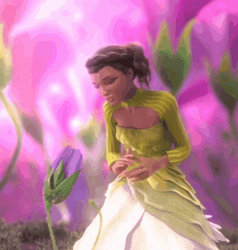 a woman in a green and white dress is holding a flower