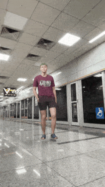 a man wearing a t-shirt that says ' nigglecat ' on it