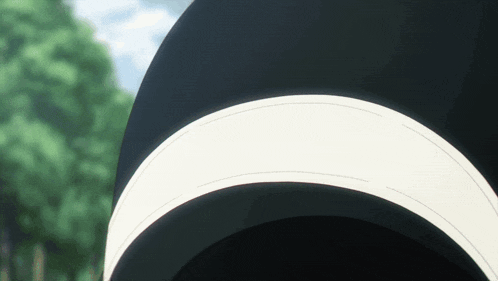 a close up of a black object with a white stripe on the bottom