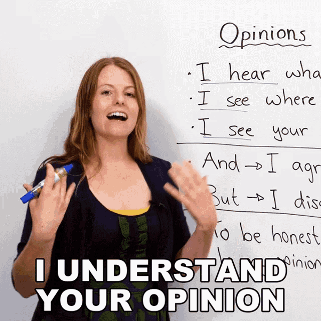 a woman stands in front of a white board that says opinions on it