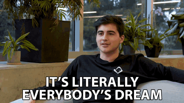 a man sitting on a couch with the words it 's literally everybody 's dream on the bottom