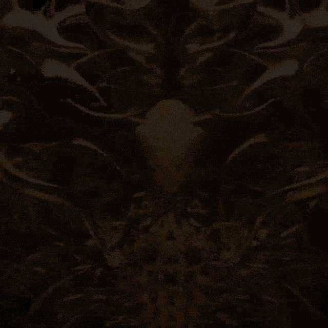 a computer generated image of a brain with a yellow center and red vessels