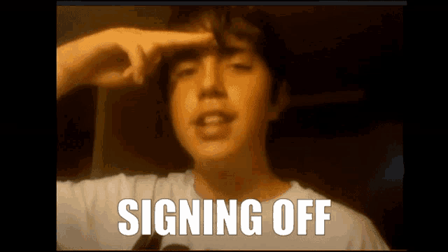 a young man is making a funny face with the words signing off written above him