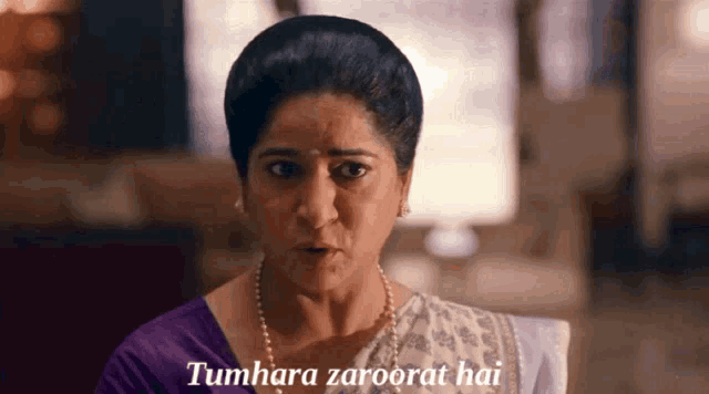 a woman says tumhara zaroorat hai in a purple top