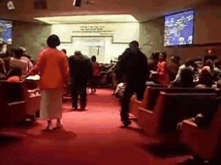 a blurred image of people in a church