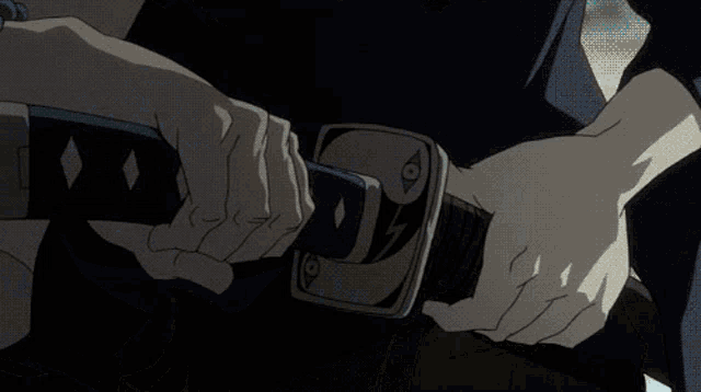 a person is holding a sword in their hand against a blue sky .