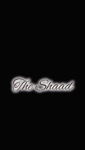 a man wearing sunglasses and a hat with the word shaad on the bottom