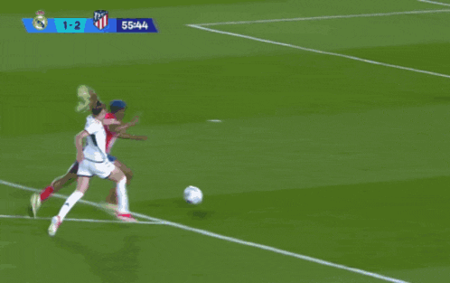 a soccer game is being played with the score 1-2
