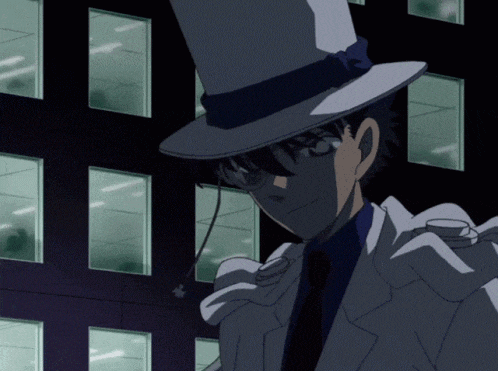 a man in a top hat stands in front of a dark building