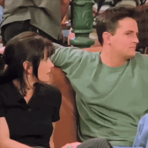a man and a woman sitting next to each other