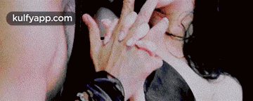 a close up of a man and woman 's hands with the words kulfyapp.com on the bottom