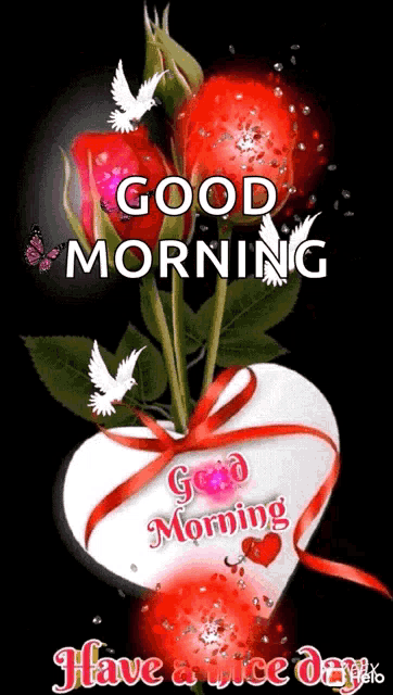 a heart shaped vase filled with red roses and the words `` good morning `` .