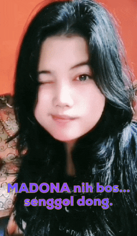a close up of a woman 's face with a caption that says madona nih bos