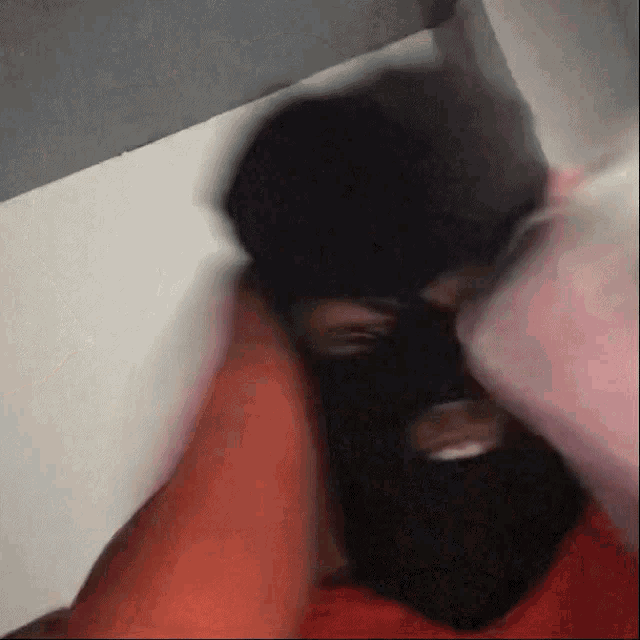 a blurry picture of a person wearing a mask