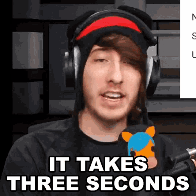 a man wearing headphones and a black shirt says it takes three seconds