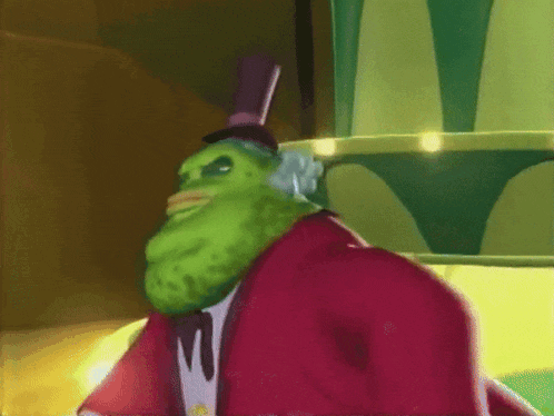 a green pickle wearing a top hat and a red coat