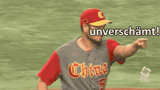 a man in a baseball uniform is pointing at something with the word unverschammt written above him .