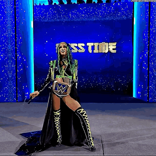a woman is holding a microphone in front of a large screen that says ' sstime '