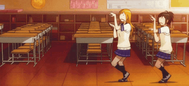 two girls are dancing in a classroom with a sign above them that says ' a ' on it
