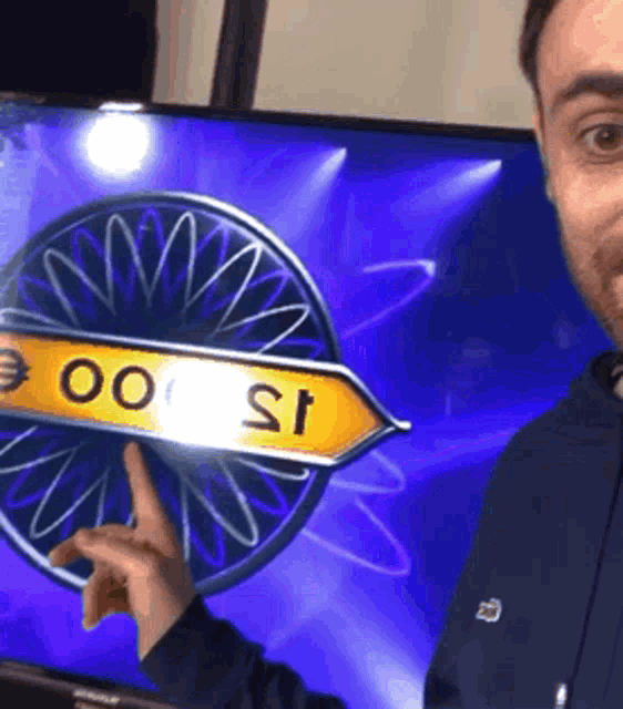 a man pointing at a sign that says 15 000