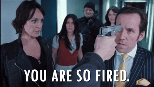 a man is pointing a gun at another man with the words " you are so fired " above him