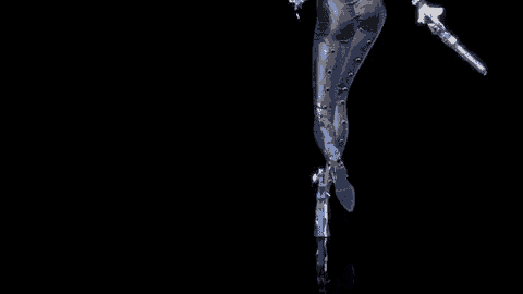 a woman in a black suit is holding two guns .