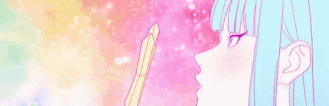 a girl is standing in front of a rainbow colored sky .