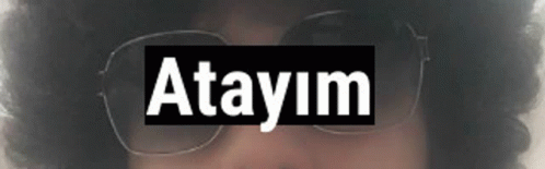 a close up of a person wearing sunglasses with the word atayim on it