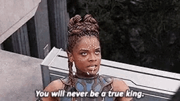 a woman is standing on a balcony talking to another woman and saying `` you will never be a true king '' .