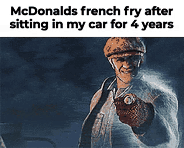 a picture of a man sitting in a car with the caption mcdonald 's french fry after sitting in my car for 4 years