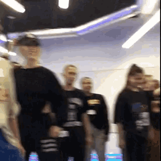 a blurry photo of a group of people with one wearing a shirt that says ' i love you '