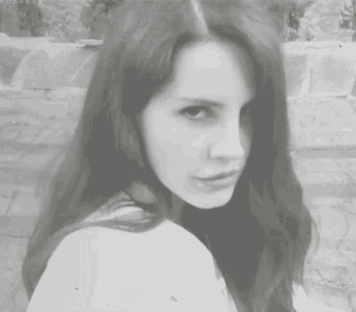 a black and white photo of a woman 's face with the letters sd on the bottom