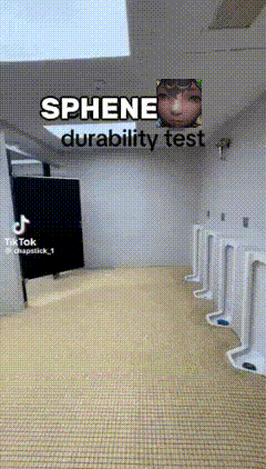 a bathroom with urinals and a sign that says ' sphene durability test ' on it