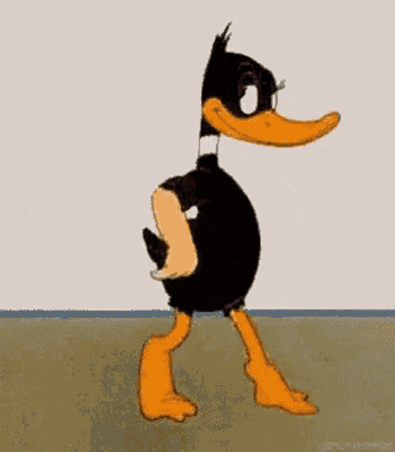 a cartoon duck standing in front of a wall