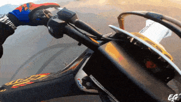 a person is riding a dirt bike with the word enduro on the side