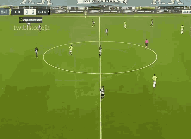 a soccer game is being played on a field with volkswagen advertisements on the wall