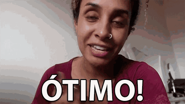 a woman with a nose ring says " otimo " in white letters