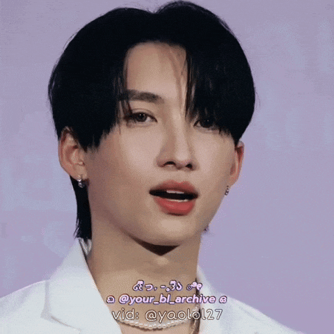 a close up of a young man 's face with a purple background and the words " your_bl_archive " on the bottom