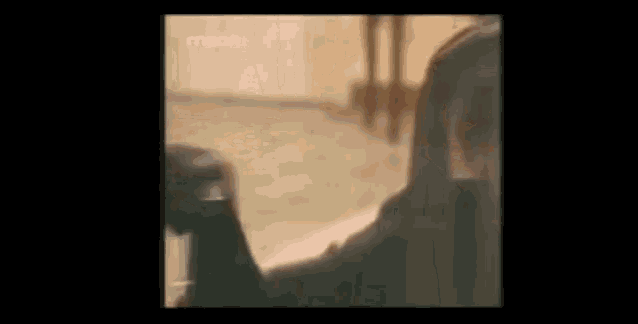 a man is talking on a cell phone in a blurry video .