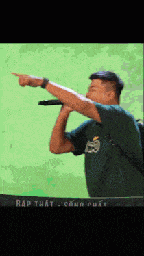 a man singing into a microphone with the word rap on the bottom right