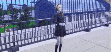 a girl in a school uniform is standing on a balcony with a fence in the background .