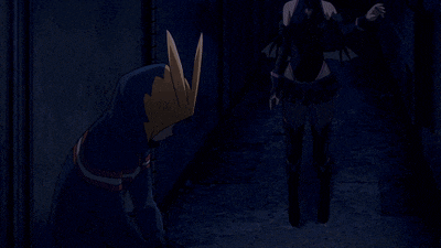 a man and a woman are standing next to each other in the dark