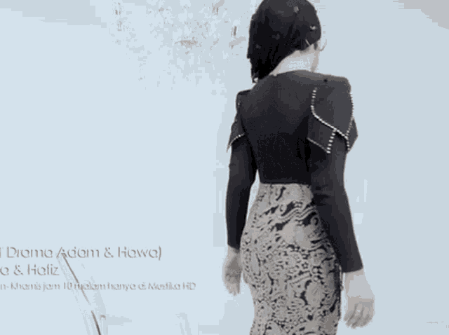 a woman is standing in front of a chandelier with the words diana adam & hawa written on the bottom