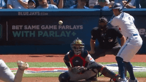 a baseball game is being played in front of a bluejays.com banner