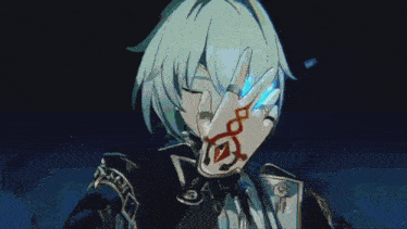 a person with a ring on their finger is holding a blue object