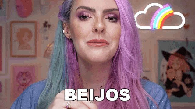 a woman with purple hair says beijos in front of a rainbow