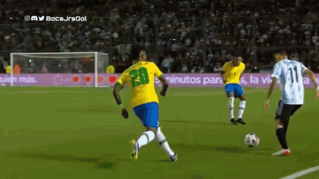 a soccer player in a yellow shirt with the number 20 on it